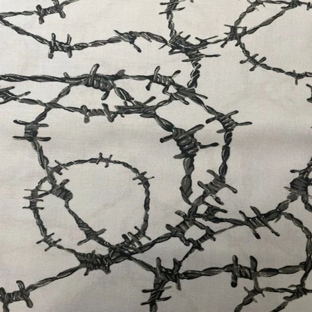 "Headgear" barbed wire black on grey design by Fabri-quilt